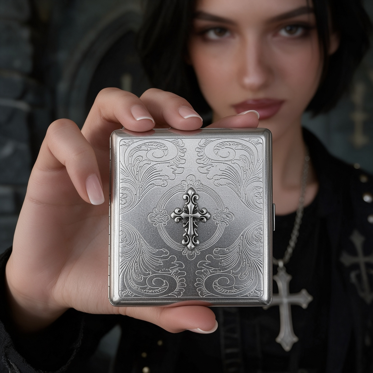 Engraved metal wallet case held up close