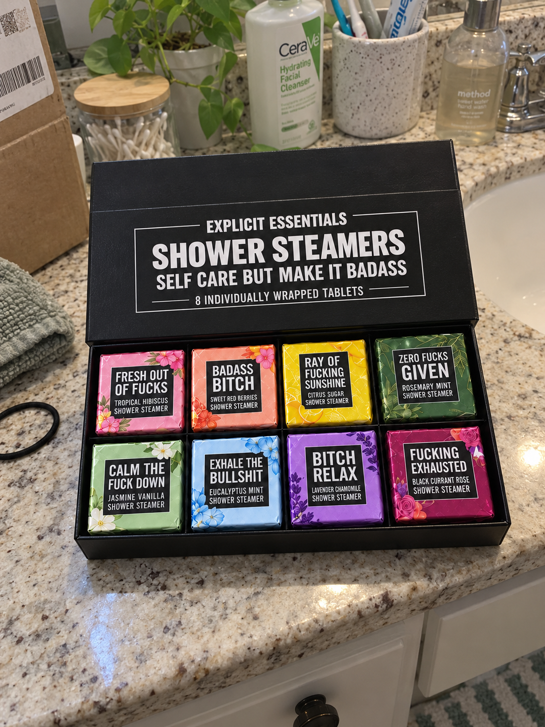 Illustrative buyer-style view of the complete shower steamer gift box on a bathroom counter