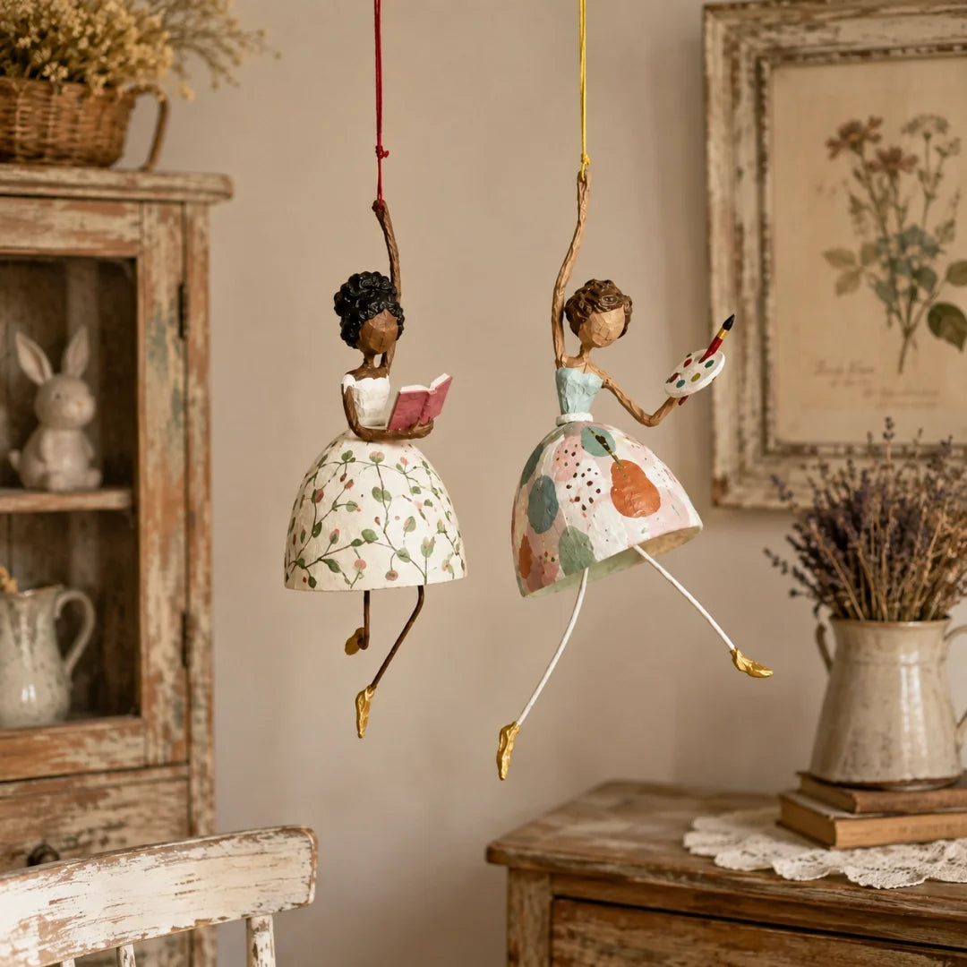 Reading Lady and Artist Lady ornaments in a warm vintage-inspired room