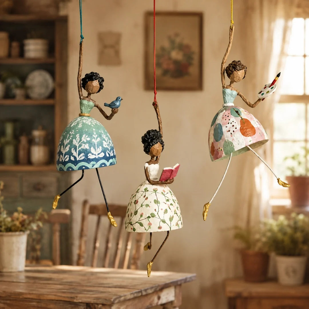 Bluebird, Reading, and Artist Lady hanging ornaments displayed as a collection