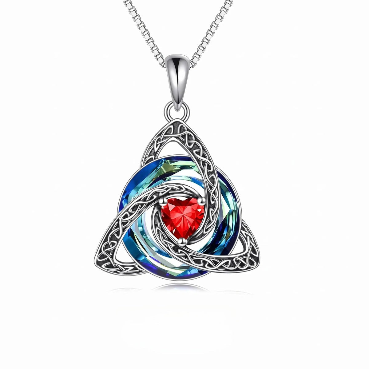 Celtic-inspired Trinity Knot pendant with a red heart-shaped center stone