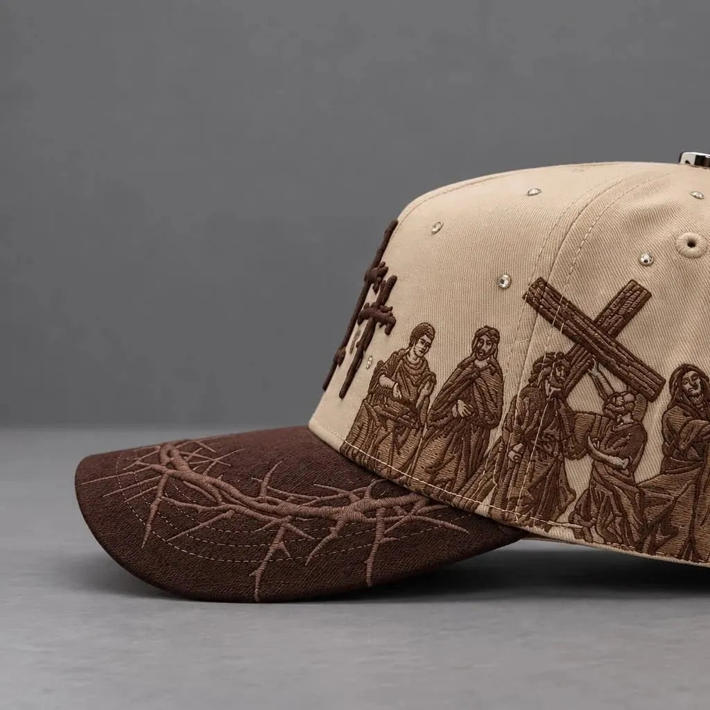 Close side view of the Viacrucis cap artwork and thorn-patterned brim