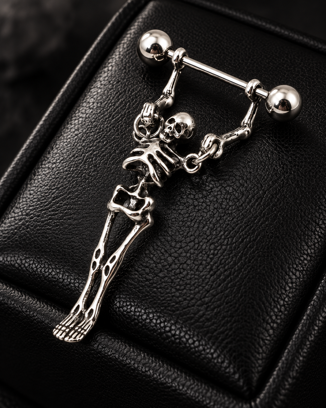 Close detail of skeleton nipple barbell
