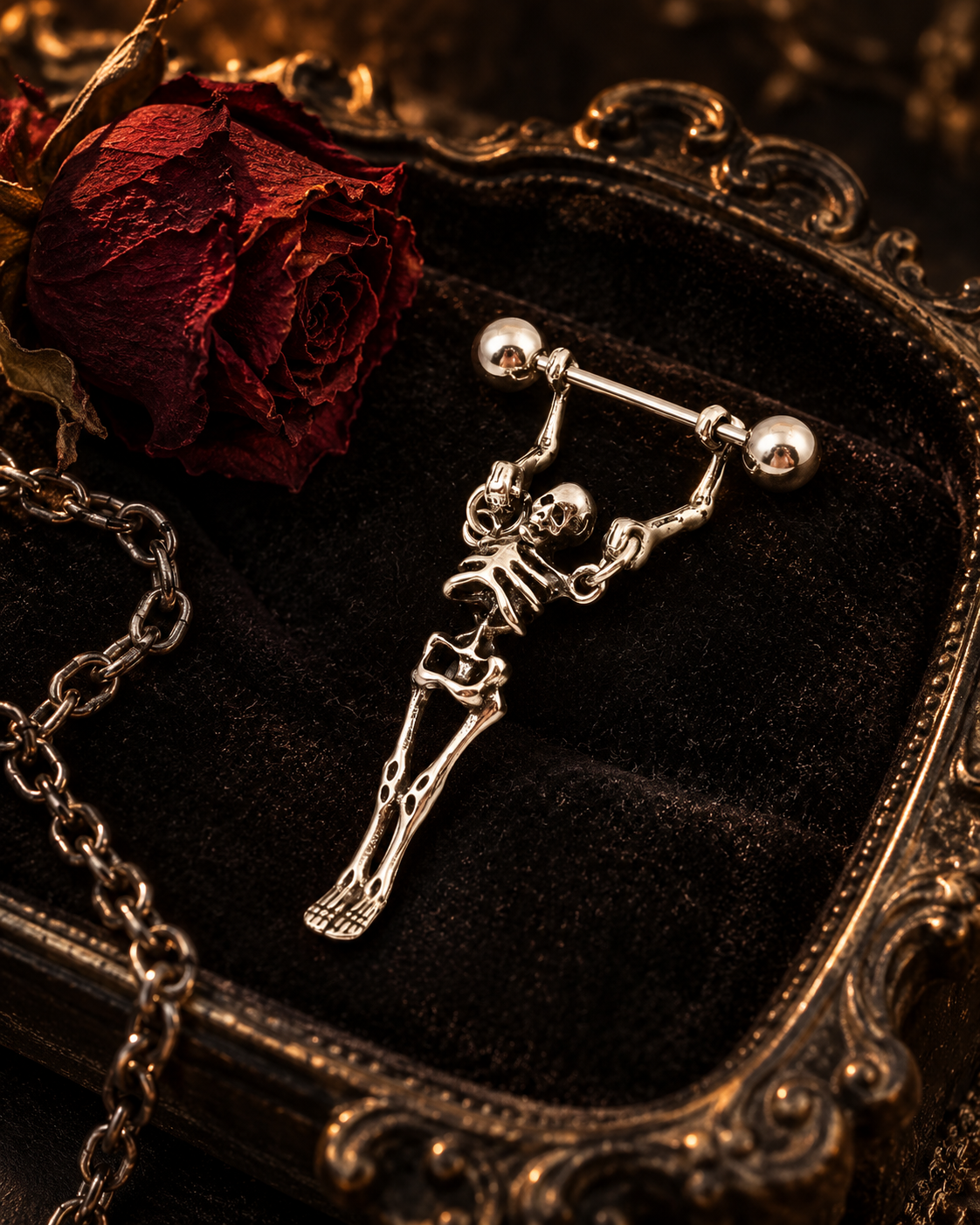 Gothic skeleton jewelry on a dark tray