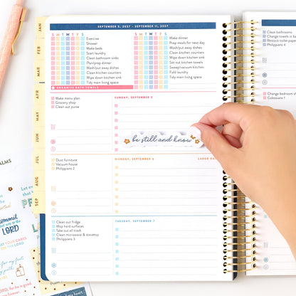 2027 navy plaid home planner checklist page with sticker