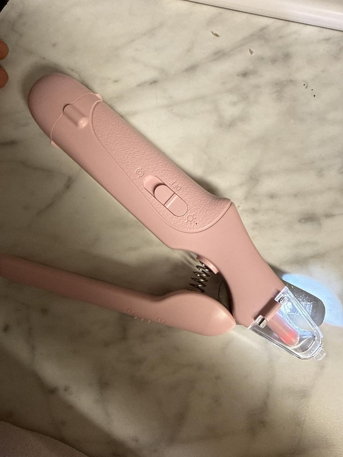 Pink pet nail grooming tool with LED light