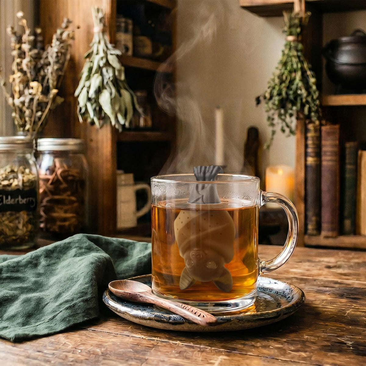 Bat tea infuser steeping in a warm cup of tea