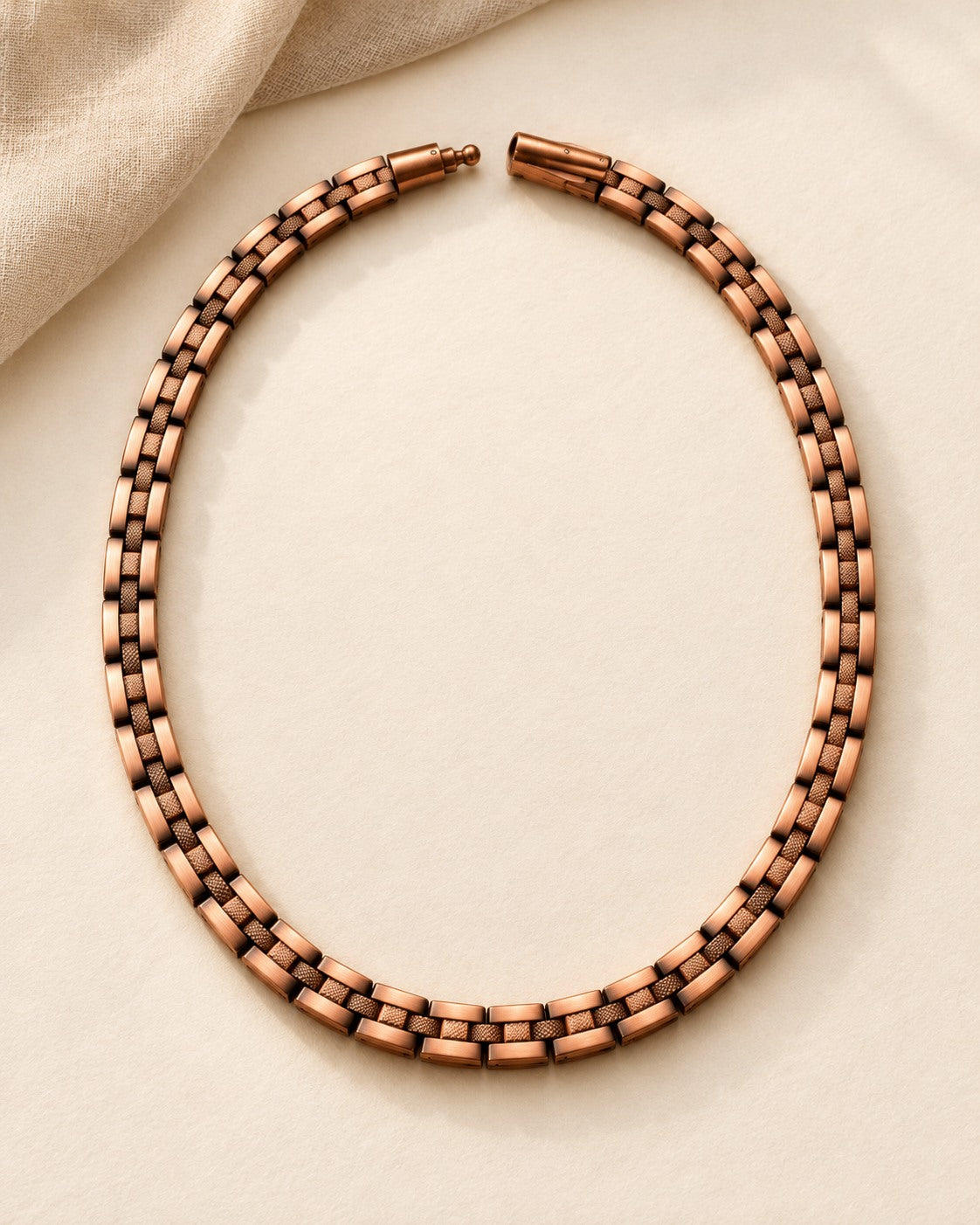 Copper chain laid out on a light background