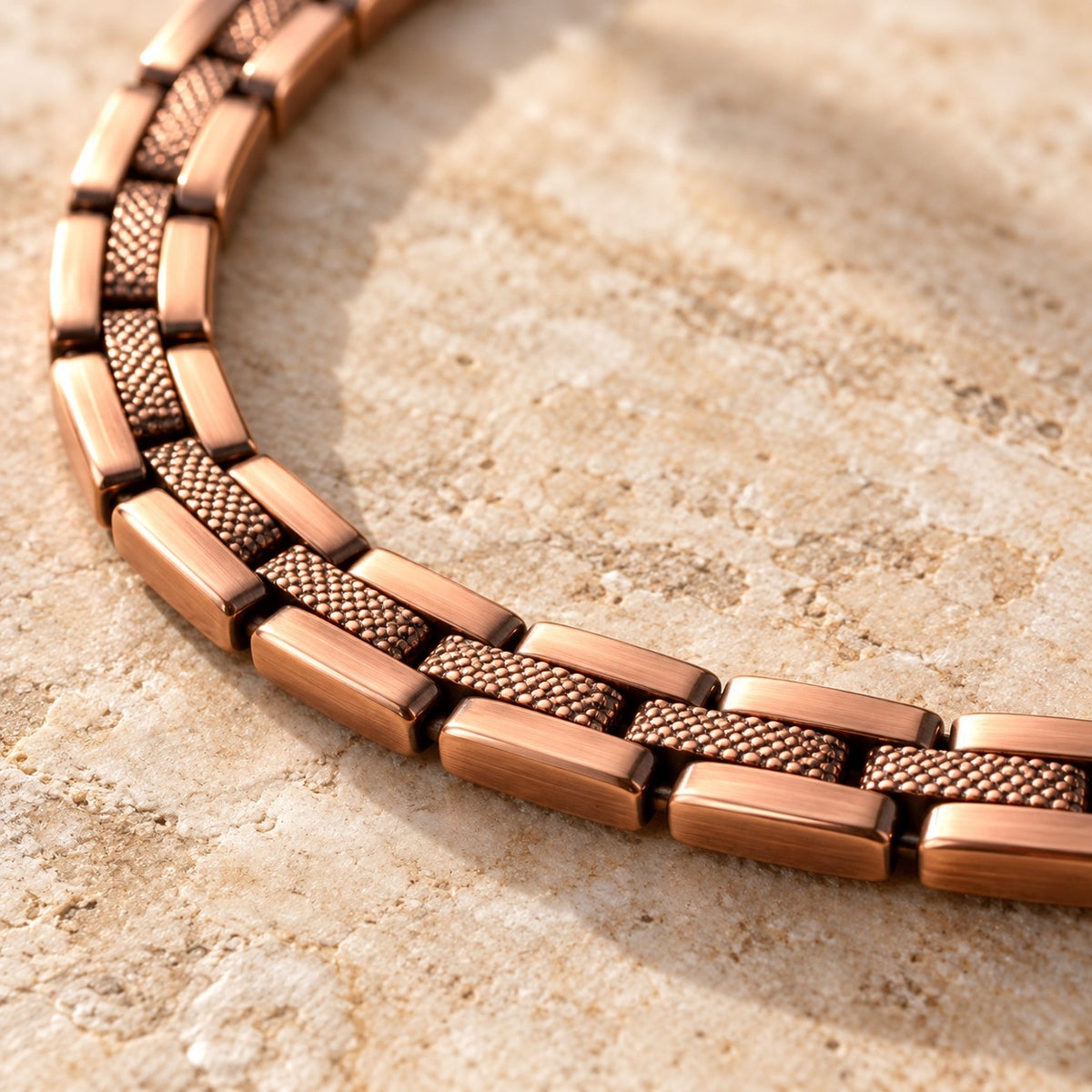 Close-up of the front surfaces of the copper chain links