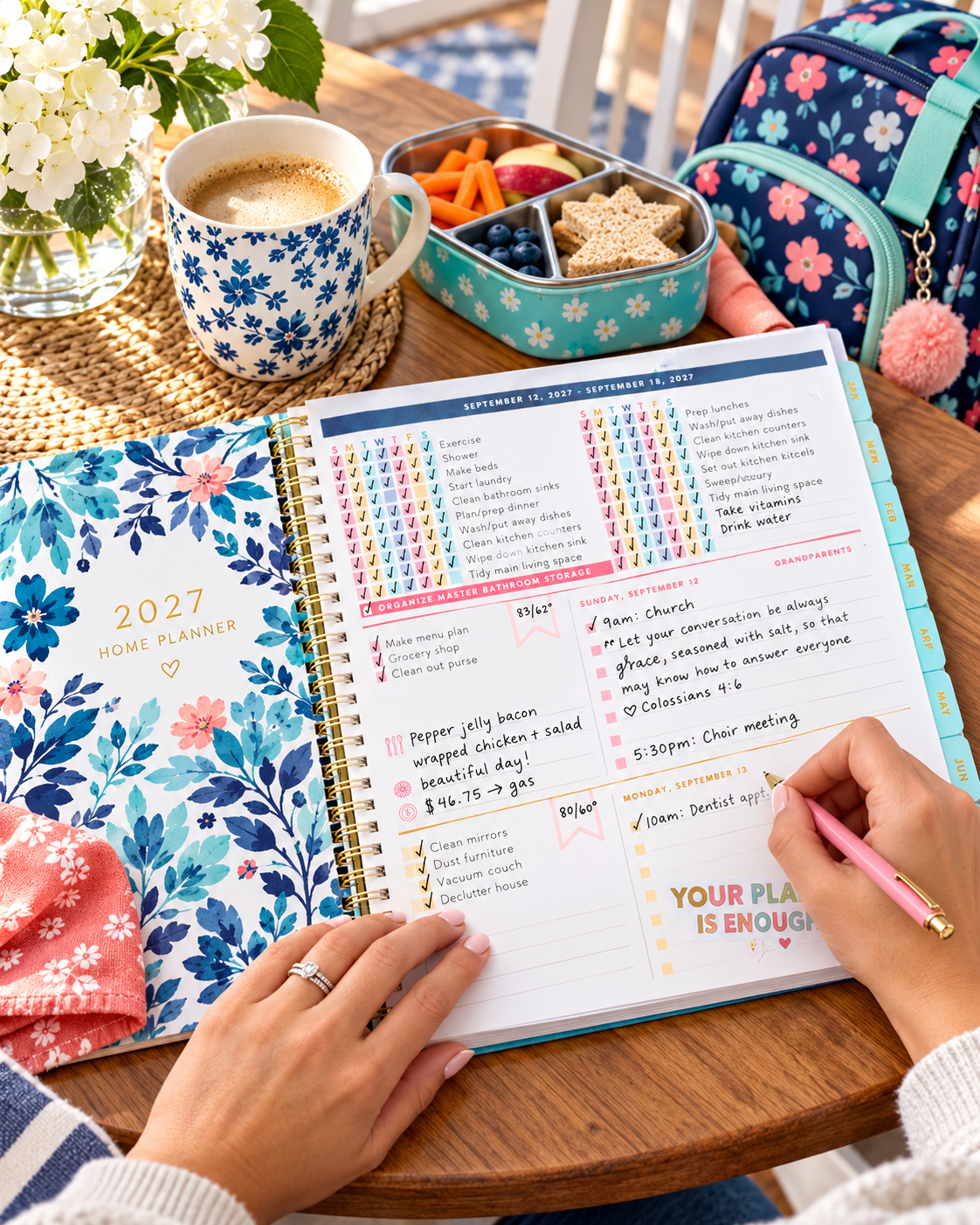 Parent using the Blue Floral Home Planner beside family essentials